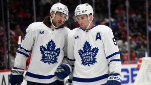 Toronto Maple Leafs defenseman Chris Tanev (8), talks with center John Tavares (91) during the first period of an NHL hockey game against the Washington Capitals, Wednesday, Nov. 13, 2024, in Washington. (Nick Wass/AP)