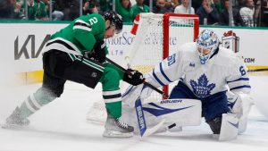 Dallas Stars defenseman Brendan Smith (2) has a shot defended by Toronto Maple Leafs goaltender Joseph Woll (60) during the first period of an NHL hockey game in Dallas, Wednesday, Dec. 18, 2024. (Michael Ainsworth/AP)