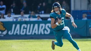 Jacksonville Jaguars quarterback Trevor Lawrence runs for yardage against the Houston Texans during the first half of an NFL game, Sunday, Dec. 1, 2024, in Jacksonville, Fla. (AP/John Raoux)