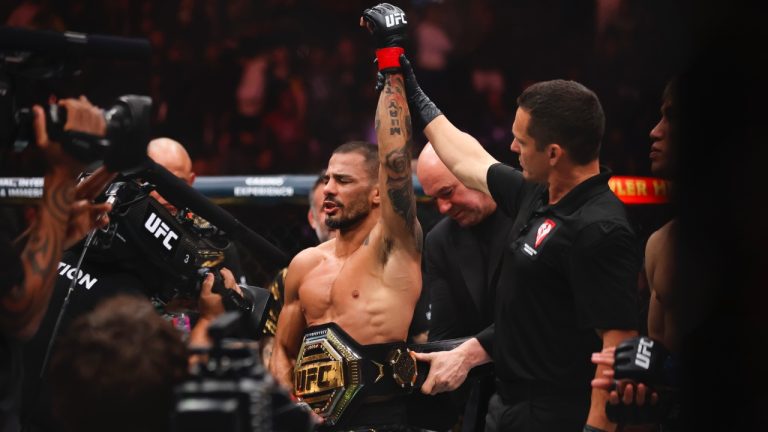 Alexandre Pantoja celebrates after he defeated Kai Asakura in a UFC 310 mixed martial arts flyweight title bout at T-Mobile Arena, Saturday, Dec. 7, 2024, in Las Vegas. (Wade Vandervort/Las Vegas Sun via AP)