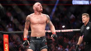 Welterweight fighter Colby Covington sticks out his tongue at Jorge Masvidal at the end of the five-round the main event during UFC 272 at T-Mobile Arena in Las Vegas in 2022. Covington won by unanimous decision. (Steve Marcus/Las Vegas Sun via AP)