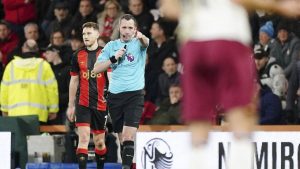 Referee Chris Kavanagh awards a penalty to West Ham United following a VAR check, during the English Premier League soccer match between Bournemouth and West Ham United, at the Vitality Stadium, in Bournemouth, England, Monday, Dec. 16, 2024. (Zac Goodwin/PA/AP)