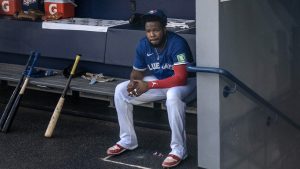 Toronto Blue Jays Vladimir Guerrero Jr. sits in the dugout before interleague baseball action against the Miami Marlins in Toronto on Sunday, Sept. 29, 2024. (Chris Young/CP)