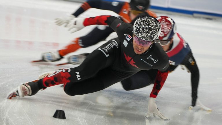 William Dandjinou of Canada leads as he competes in the heats of the Men's 500-meter at the ISU World Tour Short Track Speed Skating held at the Capital Indoor Stadium in Beijing, Friday, Dec. 6, 2024. (Andy Wong/AP)