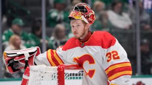 Calgary Flames goaltender Dustin Wolf (32) during the first period of an NHL hockey game against the Dallas Stars Sunday, Dec. 8, 2024, in Dallas. (LM Otero/AP)