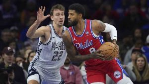 Philadelphia 76ers' Paul George, right, tries to get past Orlando Magic's Franz Wagner during the first half of an NBA basketball game, Friday, Dec. 6, 2024, in Philadelphia. (Matt Slocum/AP)