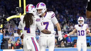 Buffalo Bills running back James Cook (4) celebrates quarterback Josh Allen (17) after scoring against the Detroit Lions during the first half of an NFL football game. (Rey Del Rio/AP)