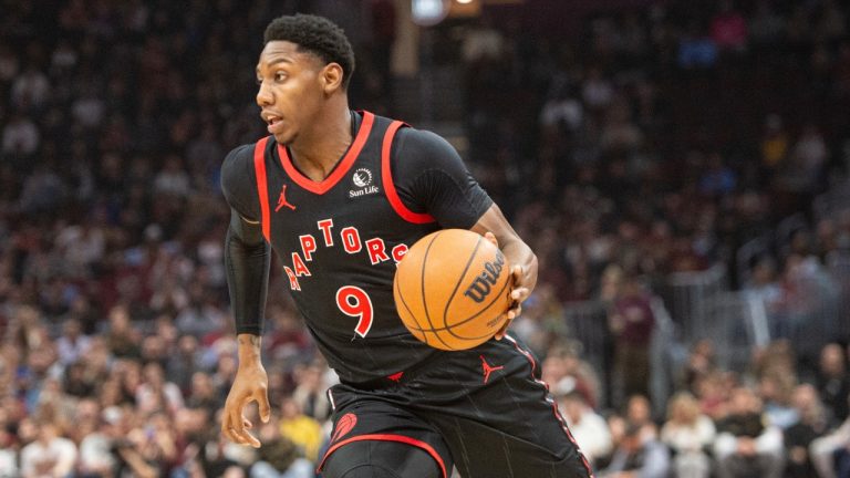 Toronto Raptors' RJ Barrett (9) drives to the basket as Jakob Poeltl (19) looks on during the first half of an NBA basketball game against the Cleveland Cavaliers in Cleveland, Sunday, Nov 24, 2024. (Phil Long/AP)