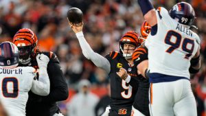 Cincinnati Bengals quarterback Joe Burrow (9) throws against the Denver Broncos during the first half of an NFL football game in Cincinnati, Saturday, Dec. 28, 2024. (Carolyn Kaster/AP)