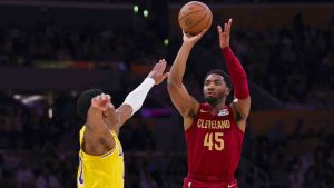 Cleveland Cavaliers guard Donovan Mitchell, right, shoots against Los Angeles Lakers forward Rui Hachimura, left, during the first half of an NBA basketball game Tuesday, Dec. 31, 2024, in Los Angeles. (Ryan Sun/AP)