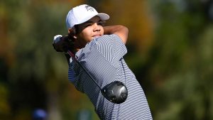 Charlie Woods tees off on the fifth hole during the first round of the PNC Championship golf tournament. (Phelan M. Ebenhack/AP)