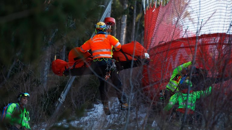 Medical staff are carrying France's Cyprien Sarrazin after crashing into protections net during an alpine ski, men's World Cup downhill training, in Bormio, Italy, Friday, Dec. 27, 2024. (Alessandro Trovati/AP)