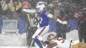 Buffalo Bills quarterback Josh Allen, middle, scores past San Francisco 49ers linebacker Fred Warner during the second half of an NFL football game in Orchard Park, N.Y., Sunday, Dec. 1, 2024. (Gene J. Puskar/AP)