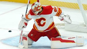 Calgary Flames goaltender Dan Vladar (80) makes a save during the first period of an NHL hockey game against the Pittsburgh Penguins Saturday, Nov. 30, 2024, in Pittsburgh. (Matt Freed/AP)