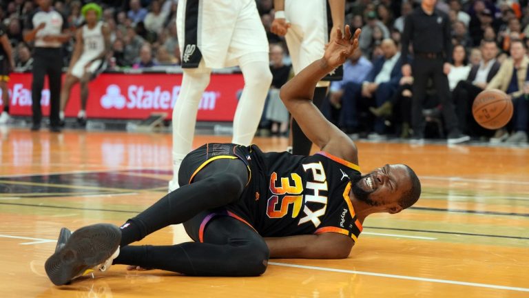 Phoenix Suns forward Kevin Durant reacts after falling to the floor against the San Antonio Spurs during the first half of an NBA basketball game, Tuesday, Dec. 3, 2024, in Phoenix. (Rick Scuteri/AP Photo)