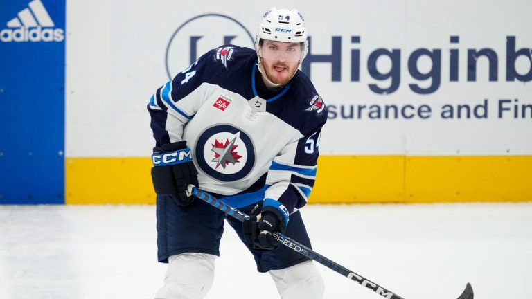 Winnipeg Jets defenceman Dylan Samberg works against the Dallas Stars during an NHL hockey game in Dallas, Thursday, April 11, 2024. (Tony Gutierrez/AP)