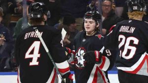 Buffalo Sabres left wing Zach Benson (9) celebrates his goal with defenseman Bowen Byram (4) during the first period of an NHL hockey game against the Chicago Blackhawks Friday, Dec. 27, 2024, in Buffalo, N.Y. (Jeffrey T. Barnes/AP)