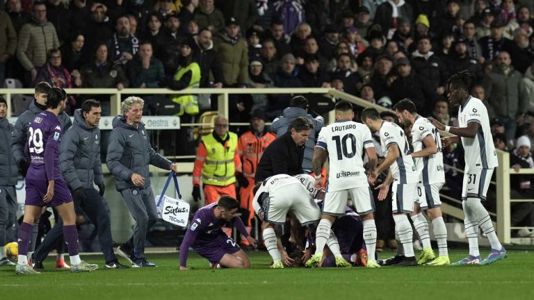 Fiorentina's Edoardo Bove, injured, is surrounded by players during the Serie A soccer match between Fiorentina and Inter at the Artemio Franchi Stadium. (Massimo Paolone/AP)