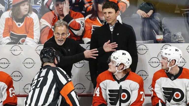 Philadelphia Flyers head coach John Tortorella talks to a referee during third period NHL action against the Winnipeg Jets. (John Woods/THE CANADIAN PRESS)
 