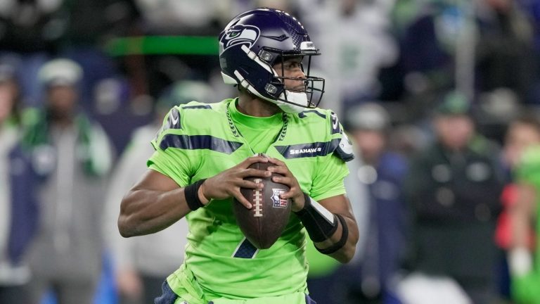 Seattle Seahawks' Geno Smith drops back during the first half of an NFL football game against the Green Bay Packers Sunday, Dec. 15, 2024, in Seattle. (Stephen Brashear/AP)