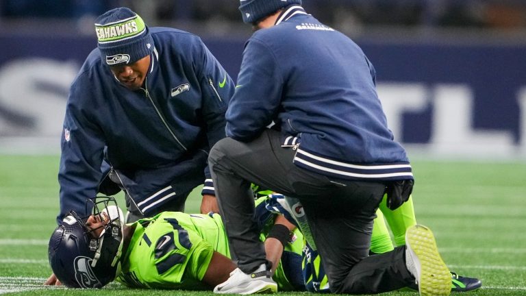 Seattle Seahawks' Geno Smith is hurt during the second half of an NFL football game against the Green Bay Packers Sunday, Dec. 15, 2024, in Seattle. (Lindsey Wasson/AP)