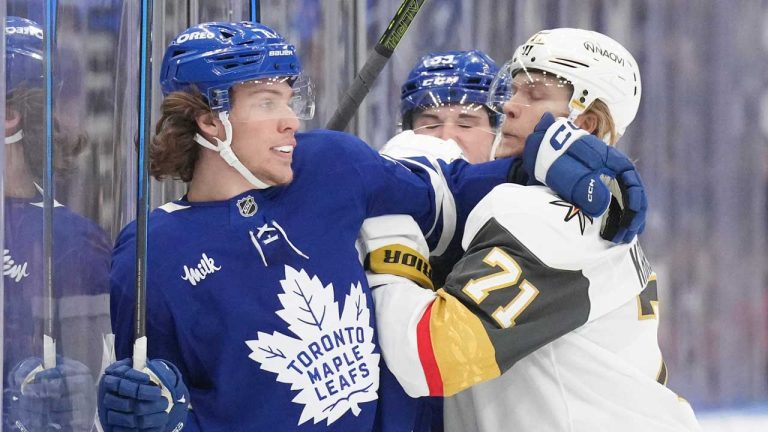 Toronto Maple Leafs Nikita Grebenkin (71) tangles on the boards with Vegas Golden Knights William Karlsson (71) during first period NHL hockey action in Toronto. (Chris Young/THE CANADIAN PRESS)