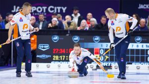 Brad Gushue (centre) shoots a stone during the KIOTI National on Nov. 28, 2024, in St. John's, N.L. (Anil Mungal/GSOC)