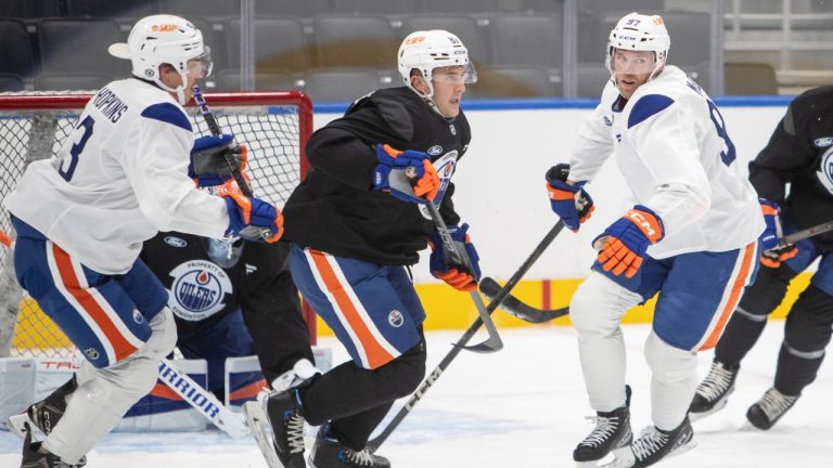 Edmonton Oilers Connor McDavid (97) and Ryan Nugent-Hopkins (93) skate with Noel Hoefenmayer (81) during training camp in Edmonton, on Thursday September 19, 2024. (Amber Bracken/CP)