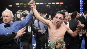 Referee Pat Russell raises the arm of Israel Vázquez of Mexico after he defeated Rafael Marquez of Mexico in their WBC super bantamweight championship bout, March. 1, 2008. (Mark J. Terrill/AP)