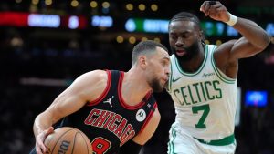 Chicago Bulls guard Zach LaVine (8) drives toward the basket as Boston Celtics guard Jaylen Brown (7) defends in the first half of an NBA basketball game, Thursday, Dec. 19, 2024, in Boston. (Steven Senne/AP)