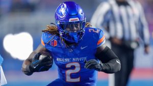 Boise State running back Ashton Jeanty (2) runs with the ball against UNLV in the first half of the Mountain West Championship NCAA college football game Friday, Dec. 6, 2024, in Boise, Idaho. (Steve Conner/AP Photo)