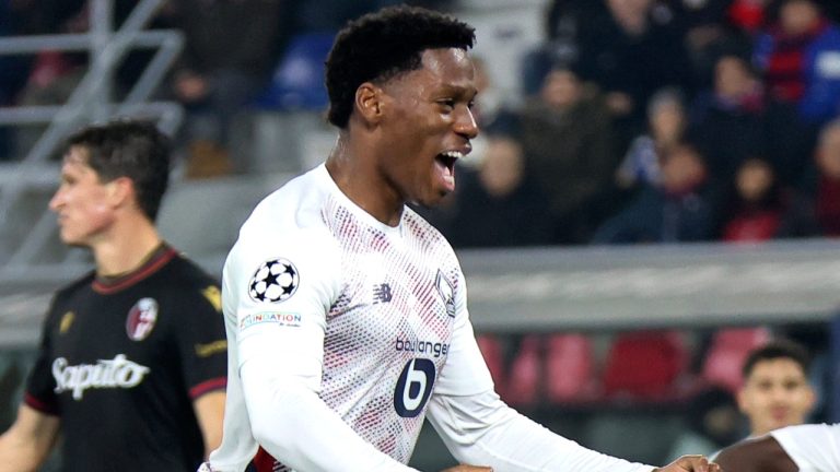 Lille's Jonathan David, front, celebrates after scoring his side's second goal during the Champions League opening phase soccer match between Bologna FC 1909 and LOSC Lille in Bologna, Italy, Wednesday, Nov. 27, 2024. (Michele Nucci/LaPresse via AP)