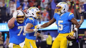 Los Angeles Chargers wide receiver Joshua Palmer (5) celebrates with teammates after a catch for a two-point conversion during the second half an NFL football game against the Denver Broncos, Thursday, Dec. 19, 2024, in Inglewood, Calif. (Ryan Sun/AP)