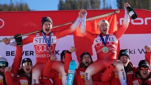 Second place finisher Switzerland's Marco Odermatt, top left, and first place finisher Justin Murisier celebrate with teammates and coach after a men's World Cup downhill skiing race, Friday, Dec. 6, 2024, in Beaver Creek. (Robert F. Bukaty/AP)