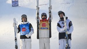 From left: In second place Japan's Horishima Ikuma, in first place Canada's Mikael Kingsbury and in third place Sweden's Walter Wallberg during the men's FIS Moguls Idre World Cup in Idre Friday Dec. 6, in Idre Sweden. (Nisse Schmidt/TT News Agency via AP)