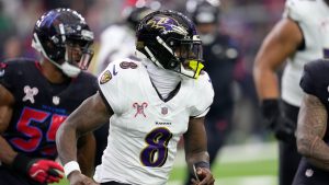 Baltimore Ravens quarterback Lamar Jackson (8) runs up field during the first half of an NFL football game against the Houston Texans, Wednesday, Dec. 25, 2024, in Houston. (David J. Phillip/AP Photo)