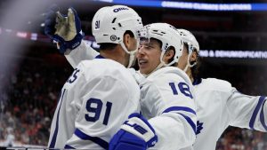 Toronto Maple Leafs right wing Mitch Marner (16) celebrates with centre John Tavares (91) after scoring a goal against the Detroit Red Wings during the first period of an NHL hockey game Friday, Dec. 27, 2024, in Detroit. (Duane Burleson/AP Photo)