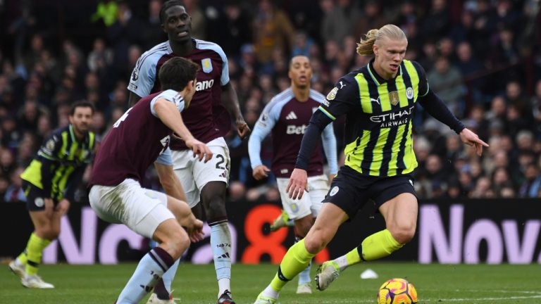 Manchester City's Erling Haaland, right, controls the ball during the English Premier League soccer match between Aston Villa and Manchester City, at Villa Park in Birmingham, England, Saturday, Dec. 21, 2024. (Rui Vieira/AP)