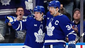 Toronto Maple Leafs' Auston Matthews (34) celebrates his goal against the Nashville Predators with Mitch Marner (16) during third period NHL hockey action in Toronto on Wednesday, December 4, 2024. (Frank Gunn/CP)