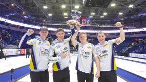 Bruce Mouat, Grant Hardie, Bobby Lammie and Hammy McMillan Jr. celebrate with the Kioti National trophy on Dec. 1, 2024, in St. John's, N.L. (Anil Mungal/GSOC)