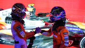 McLaren driver Lando Norris of Britain is congratulated by teammate Oscar Piastri, left, of Australia after winning the Singapore Formula One Grand Prix at the Marina Bay Street Circuit, in Singapore, Sunday, Sept. 22, 2024. (Vincent Thian/AP)