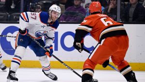 Edmonton Oilers center Connor McDavid (97) looks to shoot against Anaheim Ducks defenseman Jacob Trouba (65) during the first period of an NHL hockey game in Anaheim, Calif., Sunday, Dec. 29, 2024. (Alex Gallardo/AP)