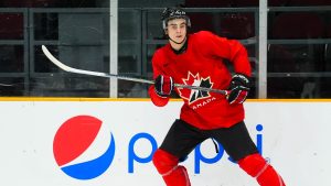 Porter Martone (24) looks to the puck during the Canadian World Junior Hockey Championships selection camp scrimmage against U Sports in Ottawa on Thursday, Dec. 12, 2024. (Sean Kilpatrick/CP)