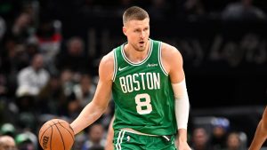 Boston Celtics center Kristaps Porzingis (8) in action during the first half of an NBA basketball game against the Washington Wizards, Sunday, Dec. 15, 2024, in Washington. (Nick Wass/AP Photo)