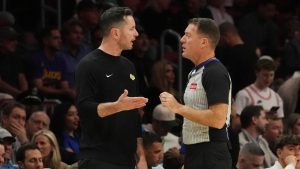 Los Angeles Lakers head coach JJ Redick challenges a call with referee Brent Barnaky during the first half of an NBA basketball game against the Miami Heat, Wednesday, Dec. 4, 2024, in Miami. (Marta Lavandier/AP Photo)