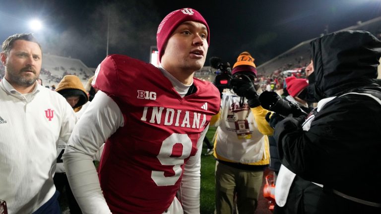 Indiana quarterback Kurtis Rourke (9) runs off the field after the team defeated Purdue in an NCAA college football game, Saturday, Nov. 30, 2024, in Bloomington, Ind. (Darron Cummings/AP Photo)