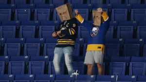 Buffalo Sabres fans react prior to an NHL hockey game against the New York Rangers, Saturday, April 3, 2021, in Buffalo, N.Y. (Jeffrey T. Barnes/AP Photo)