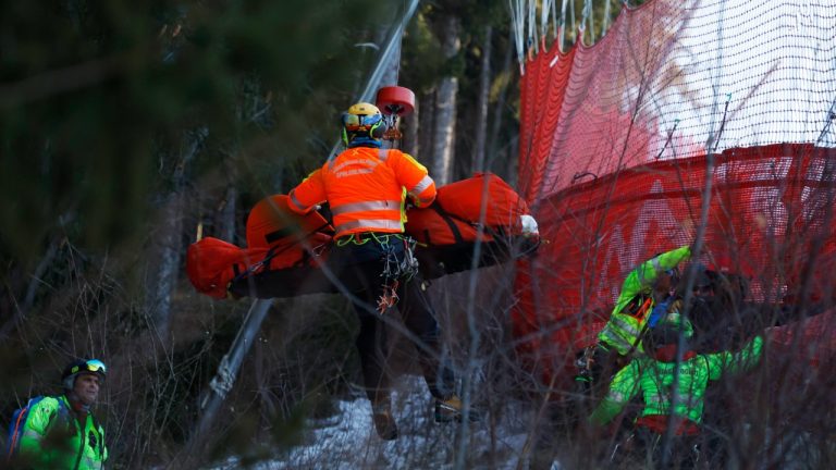 Medical staff are carrying France's Cyprien Sarrazin after crashing into protections net during an alpine ski, men's World Cup downhill training, in Bormio, Italy, Friday, Dec. 27, 2024. (Alessandro Trovati/AP)