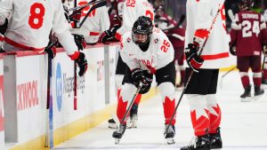 Canada's Matthew Schaefer (25) leaves the ice after colliding with the net during first period IIHF World Junior Hockey Championship preliminary round action against Latvia in Ottawa on Friday, Dec. 27, 2024. (Sean Kilpatrick/THE CANADIAN PRESS)