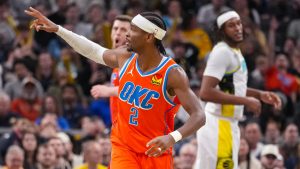 Oklahoma City Thunder guard Shai Gilgeous-Alexander (2) gestures after a three-point basket against the Indiana Pacers during the second half of an NBA basketball game in Indianapolis, Thursday, Dec. 26, 2024. (Michael Conroy/AP Photo)